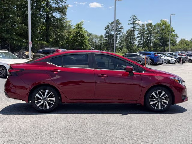 2024 Scarlet Ember Tintcoat Nissan Versa 1.6 SV FWD Sedan