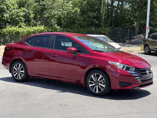 2024 Scarlet Ember Tintcoat Nissan Versa 1.6 SV FWD Sedan
