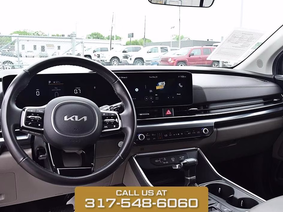 2025 Aurora Black Kia Carnival LXS FWD Van
