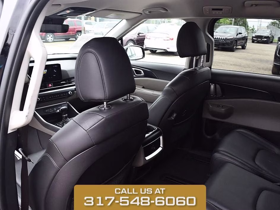 2025 Aurora Black Kia Carnival LXS FWD Van