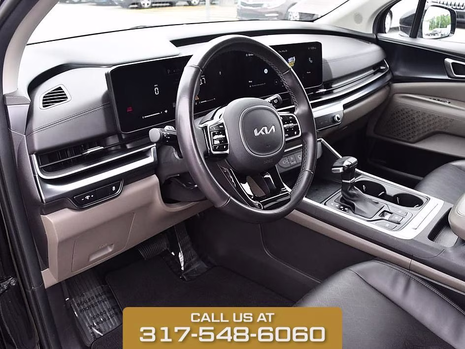 2025 Aurora Black Kia Carnival LXS FWD Van