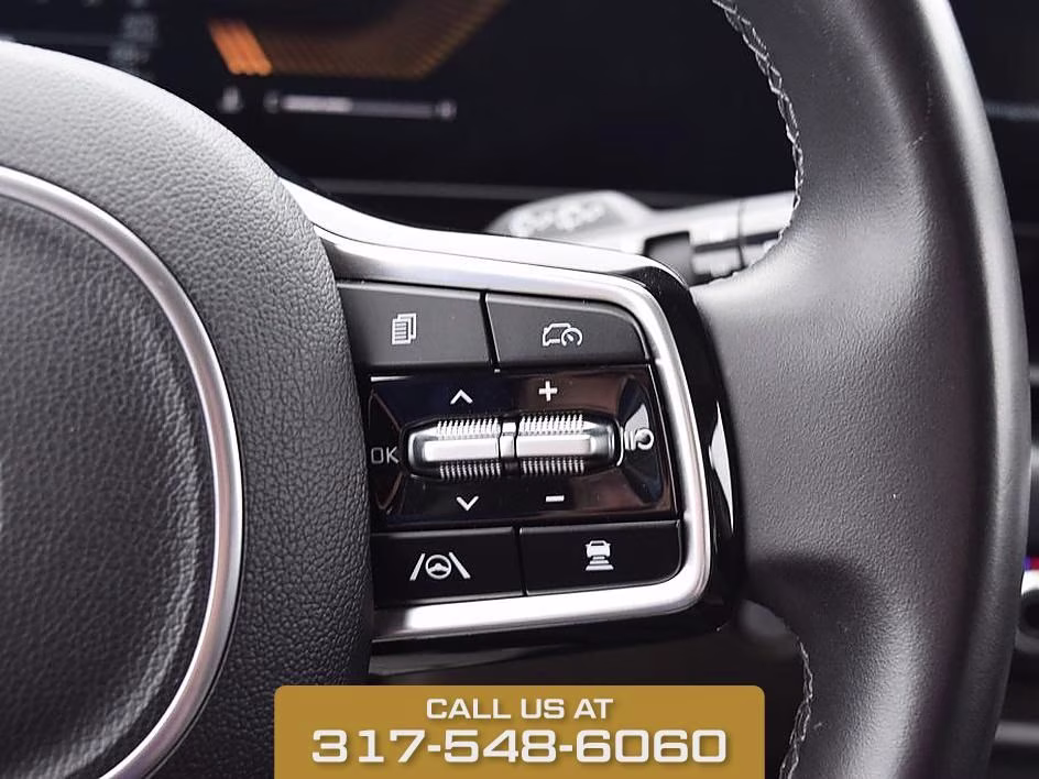 2025 Aurora Black Kia Carnival LXS FWD Van