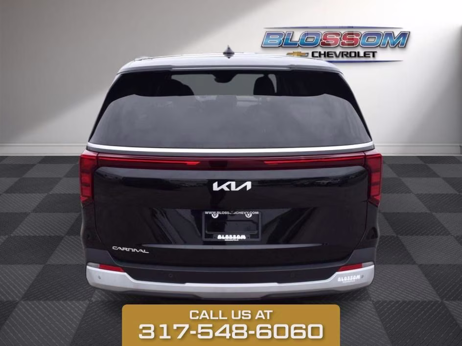 2025 Aurora Black Kia Carnival LXS FWD Van