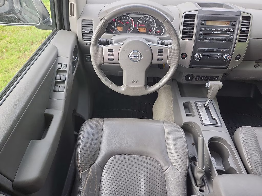 2012 Super Black Metallic Nissan Frontier SL 4X4 Truck