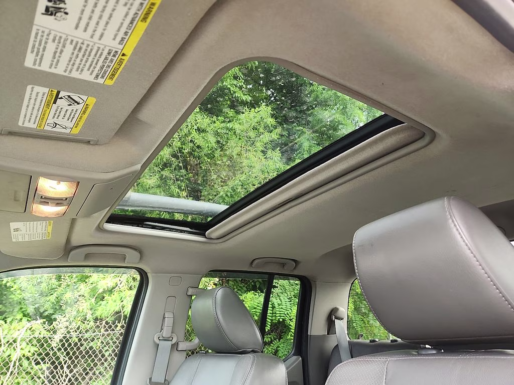 2012 Super Black Metallic Nissan Frontier SL 4X4 Truck
