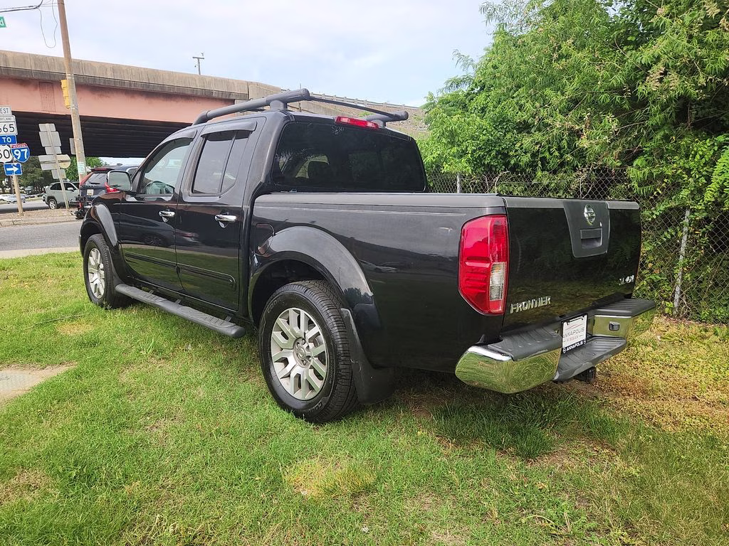 2012 Super Black Metallic Nissan Frontier SL 4X4 Truck