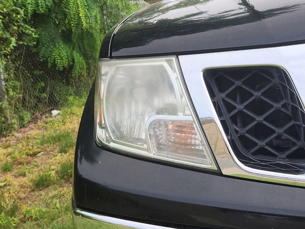 2012 Super Black Metallic Nissan Frontier SL 4X4 Truck