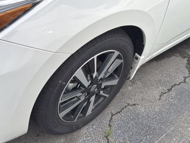 2025 Aspen White Tricoat Nissan Versa 1.6 SV FWD Sedan