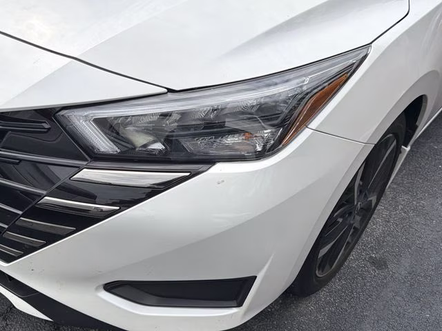 2025 Aspen White Tricoat Nissan Versa 1.6 SR FWD Sedan
