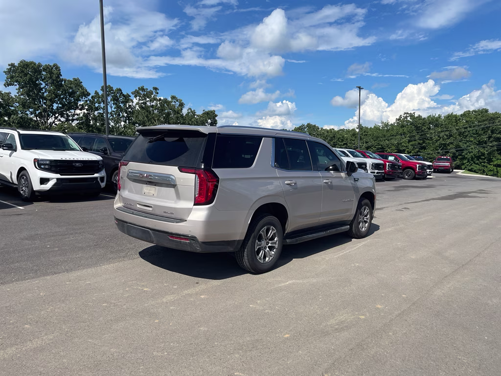 2023 Pearl Beige Metallic GMC Yukon SLE RWD SUV