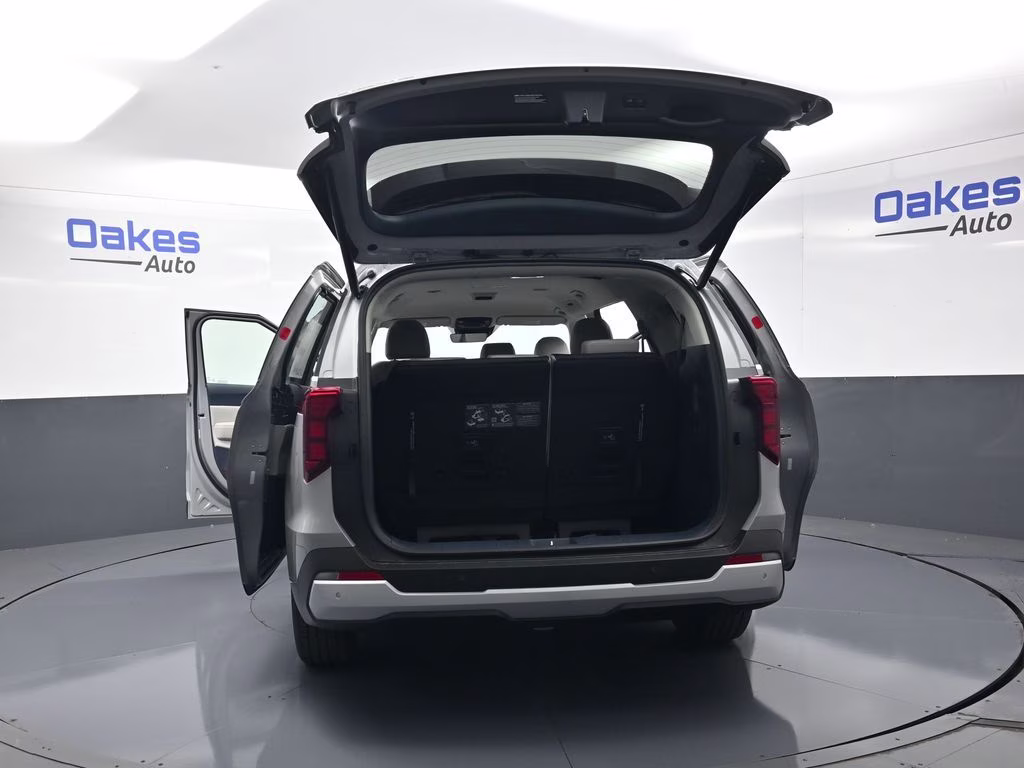 2026 Ceramic Silver Kia Carnival Hybrid EX FWD Van