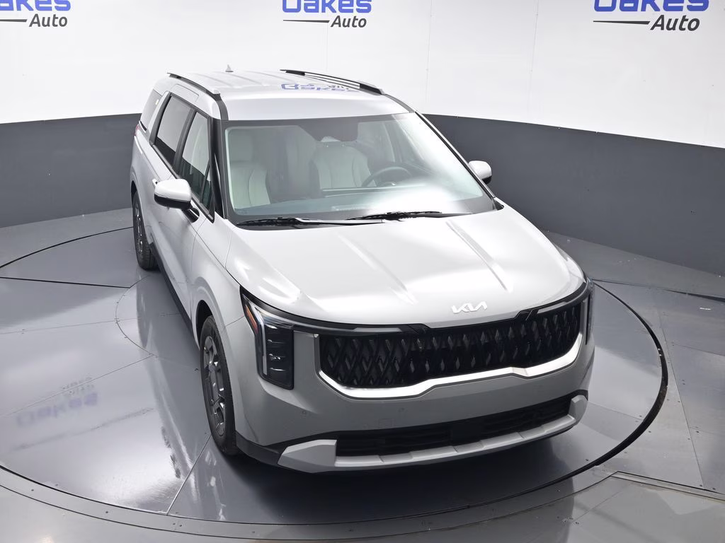 2026 Ceramic Silver Kia Carnival Hybrid EX FWD Van
