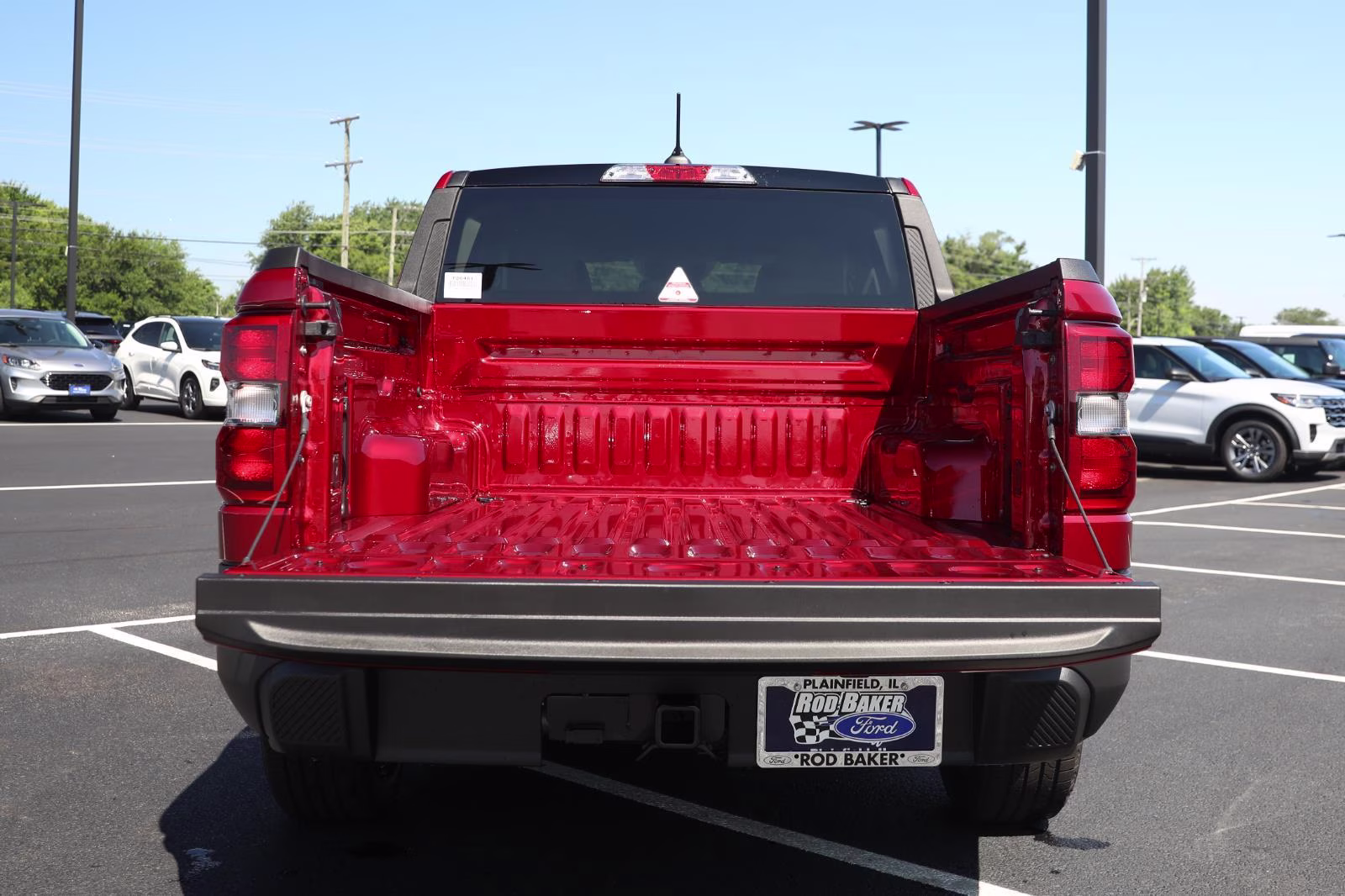 2026 Ruby Red Metallic Tinted Clearcoat Ford Maverick XLT AWD Truck