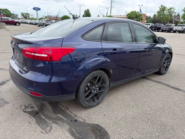2016 Blue Ford Focus SE FWD Sedan