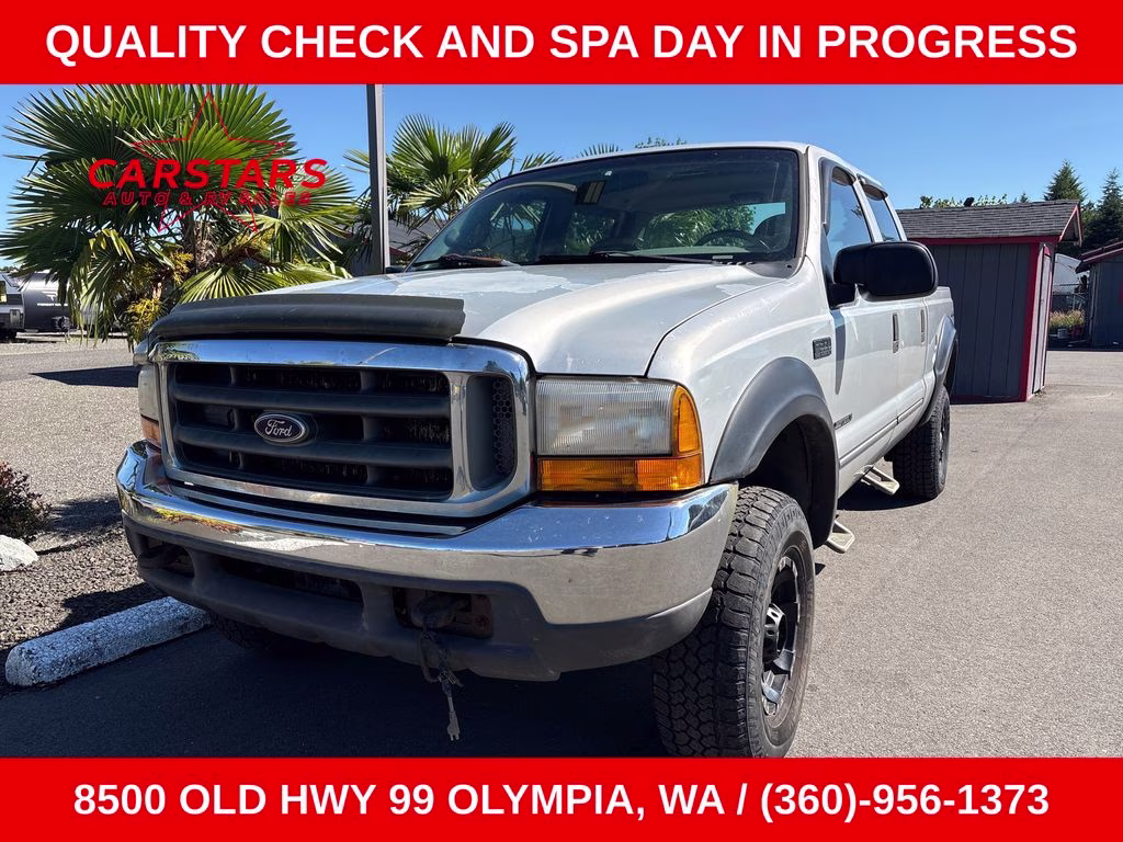 1999 Silver Ford Super Duty F-350 SRW 4X4 Truck