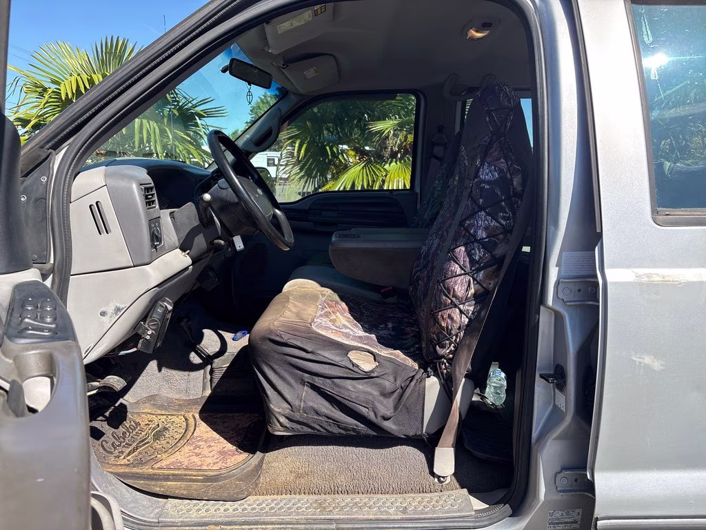 1999 Silver Ford Super Duty F-350 SRW 4X4 Truck