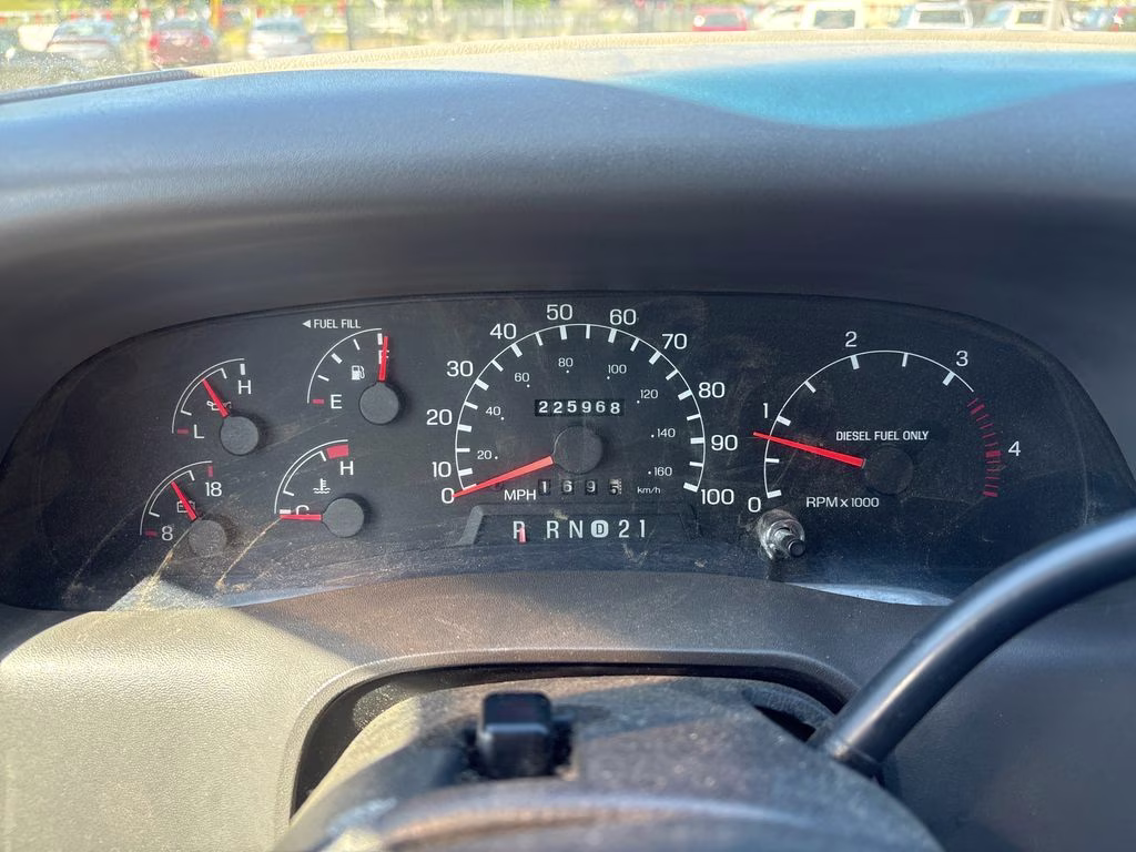 1999 Silver Ford Super Duty F-350 SRW 4X4 Truck