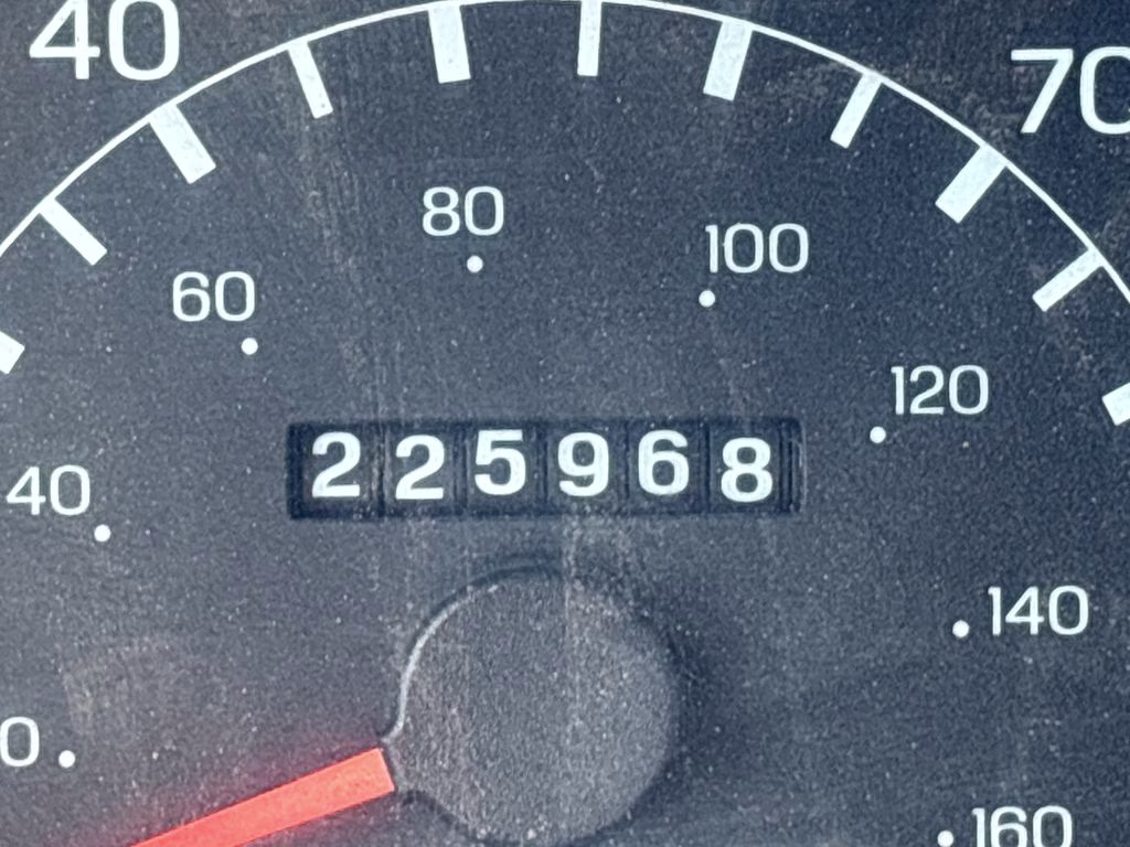 1999 Silver Ford Super Duty F-350 SRW 4X4 Truck