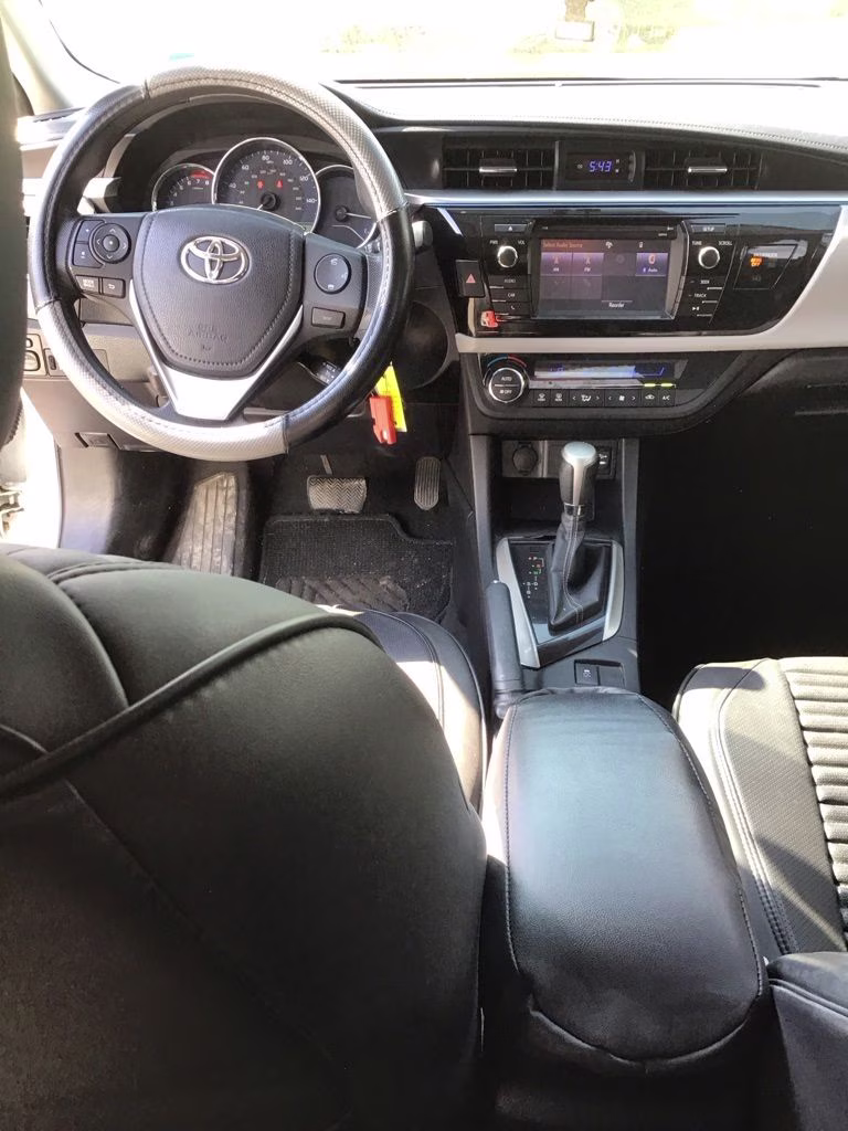 2014 Super White Toyota Corolla LE FWD Sedan