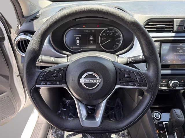 2024 Aspen White Tricoat Nissan Versa 1.6 SV FWD Sedan