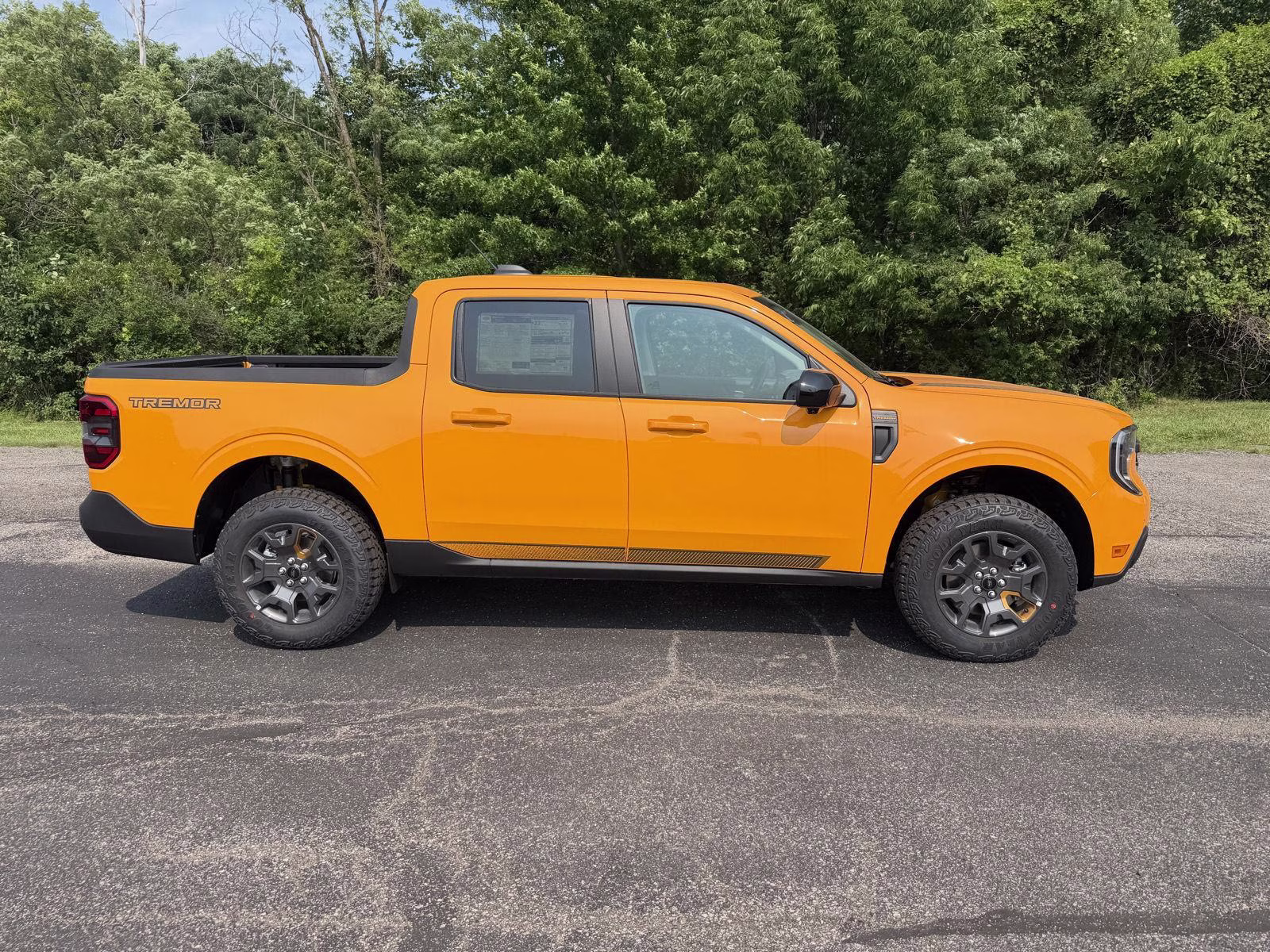 2026 Orange Fury Metallic Tri-Coat Ford Maverick Tremor AWD Truck