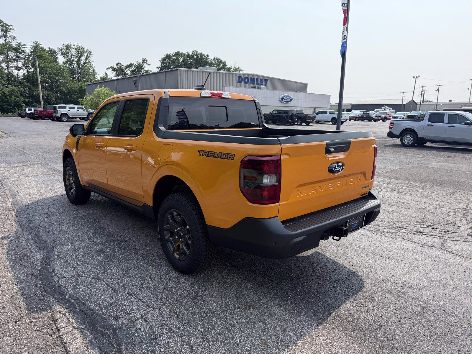 2026 Orange Fury Metallic Tri-Coat Ford Maverick Tremor AWD Truck