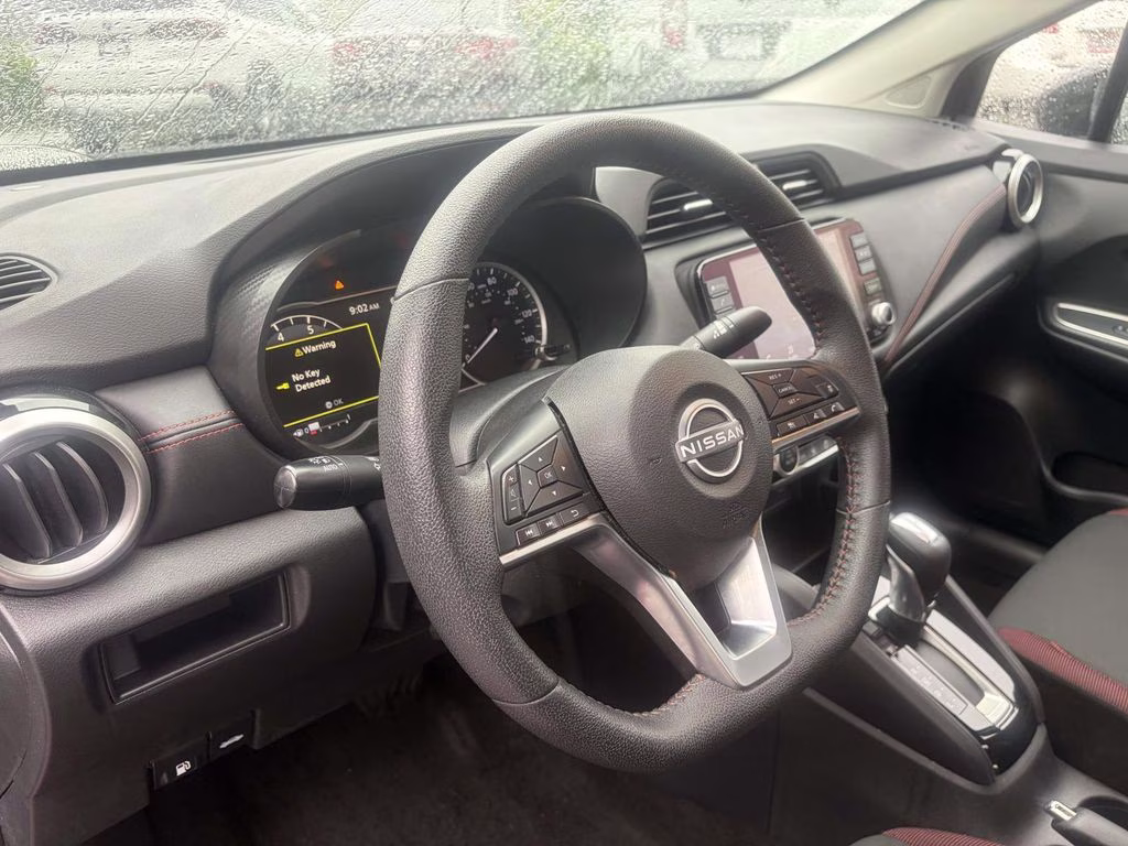 2024 Scarlet Ember Tintcoat Nissan Versa 1.6 SR FWD Sedan