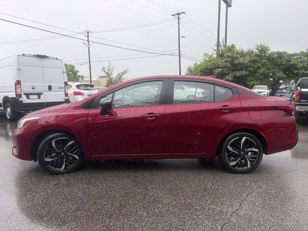 2024 Scarlet Ember Tintcoat Nissan Versa 1.6 SR FWD Sedan