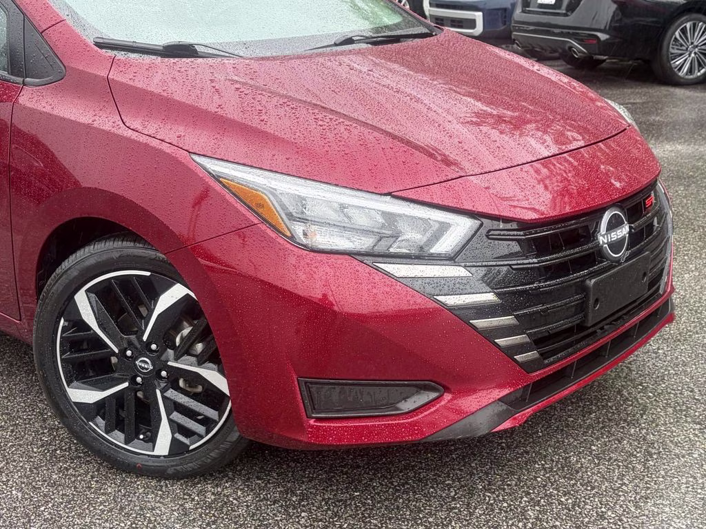 2024 Scarlet Ember Tintcoat Nissan Versa 1.6 SR FWD Sedan