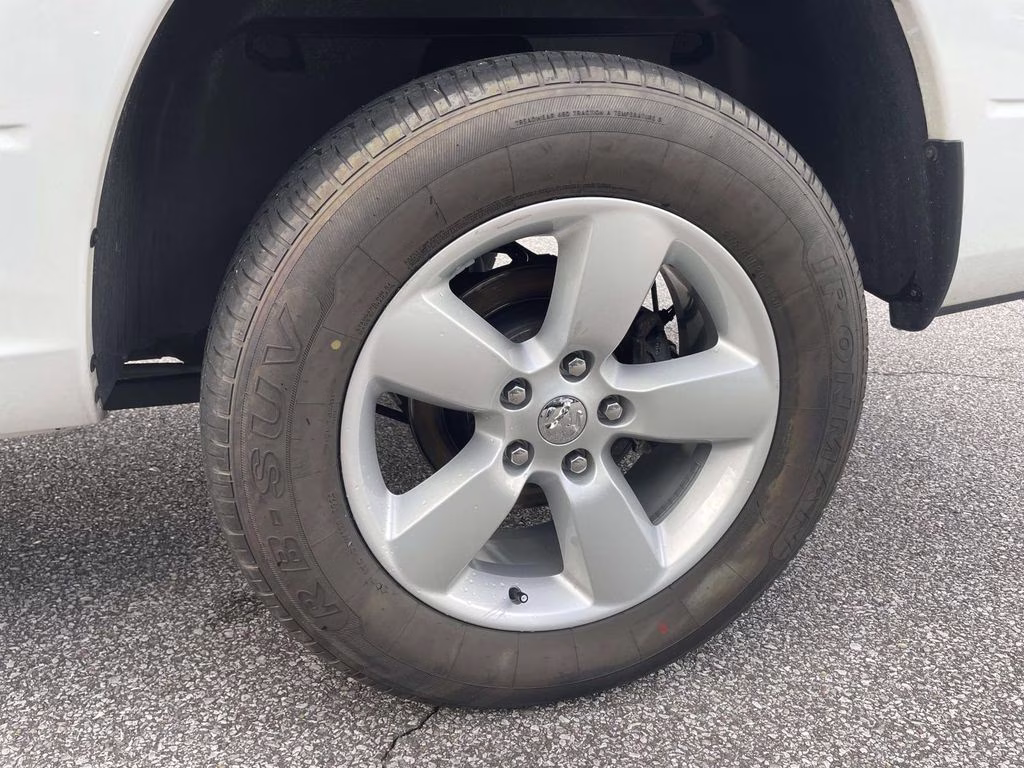 2024 Bright White Clearcoat Ram 1500 Classic SLT 4X4 Truck