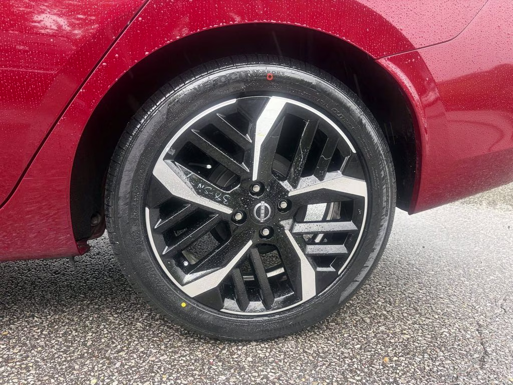 2024 Scarlet Ember Tintcoat Nissan Versa 1.6 SR FWD Sedan