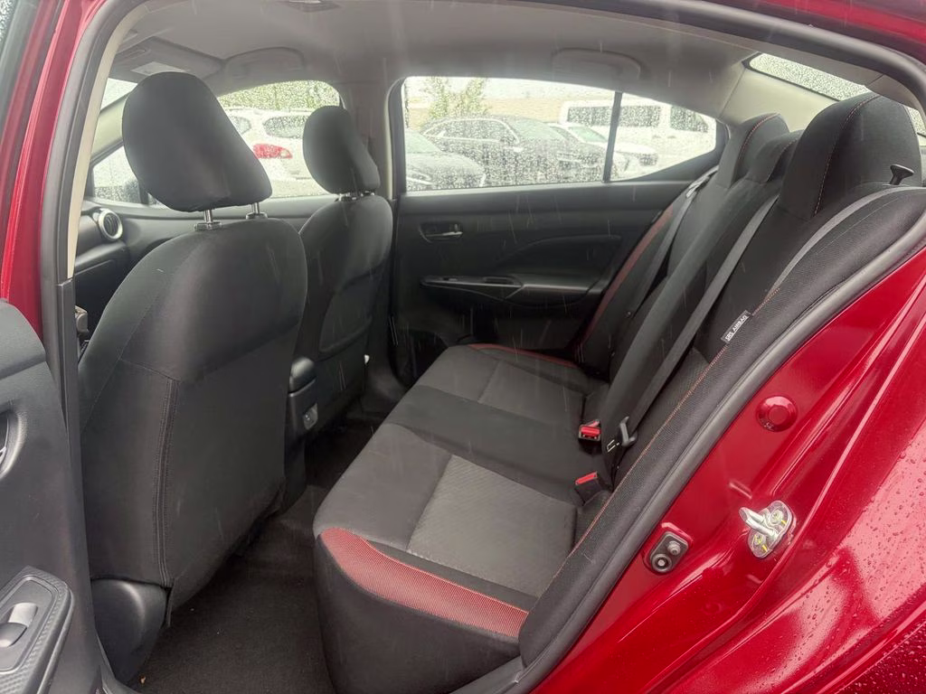 2024 Scarlet Ember Tintcoat Nissan Versa 1.6 SR FWD Sedan