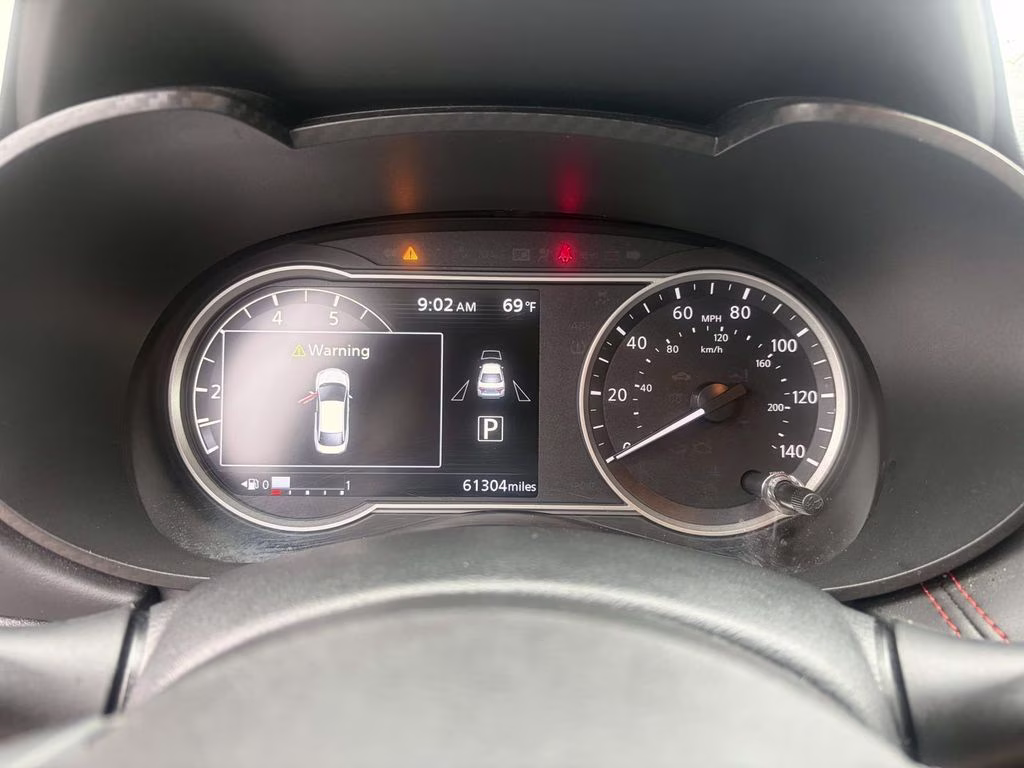 2024 Scarlet Ember Tintcoat Nissan Versa 1.6 SR FWD Sedan
