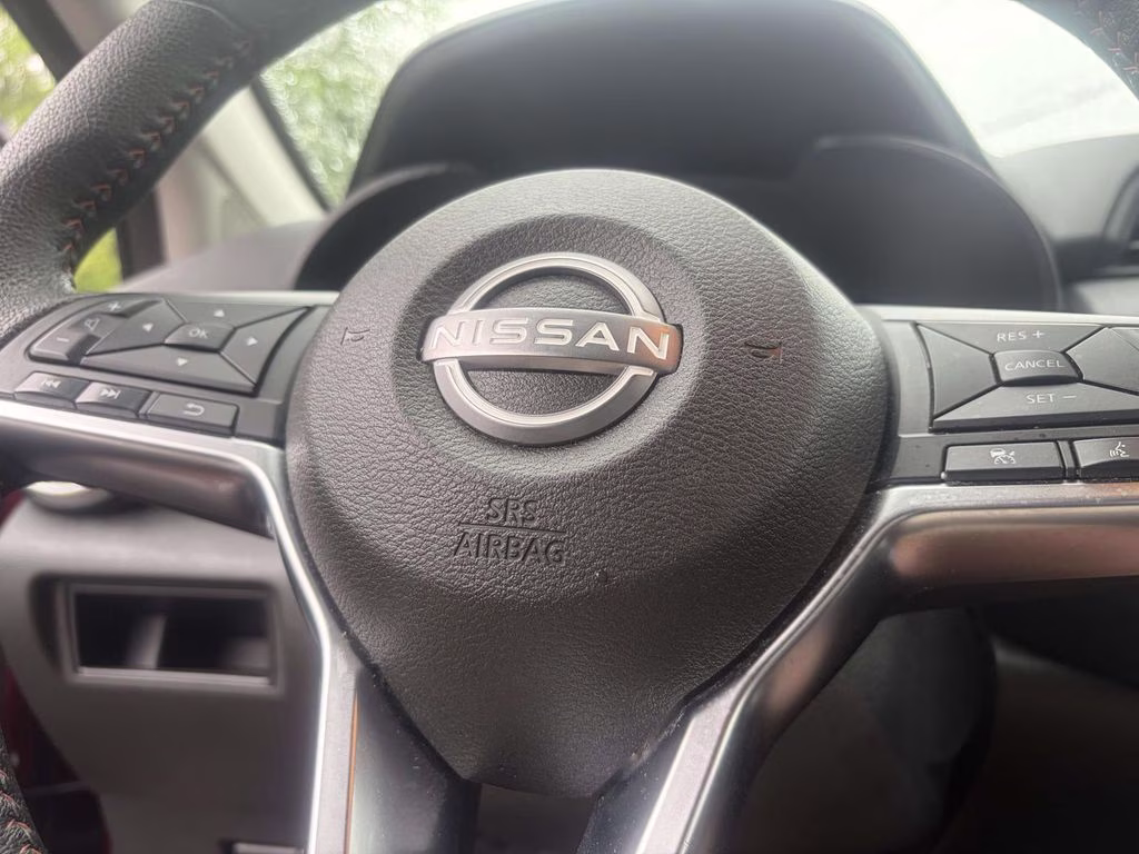 2024 Scarlet Ember Tintcoat Nissan Versa 1.6 SR FWD Sedan