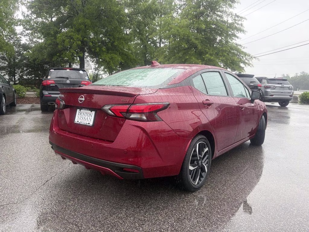 2024 Scarlet Ember Tintcoat Nissan Versa 1.6 SR FWD Sedan