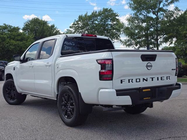 2026 Glacier White Nissan Frontier SV 4X4 Truck