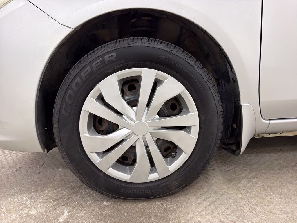 2012 Brilliant Silver Metallic Nissan Versa 1.6 SV FWD Sedan