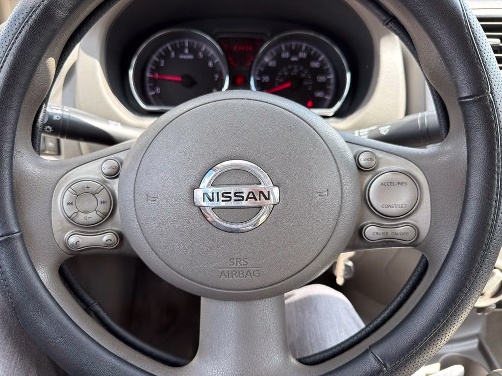 2012 Brilliant Silver Metallic Nissan Versa 1.6 SV FWD Sedan