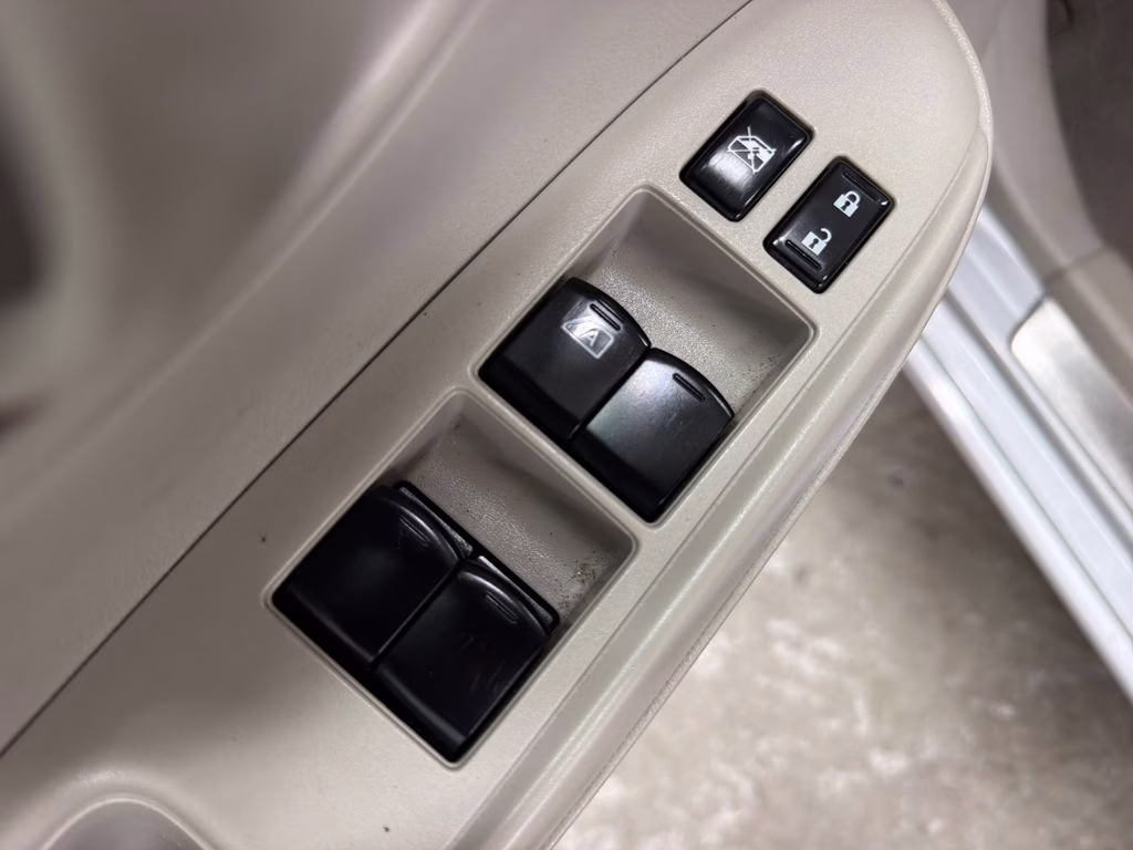 2012 Brilliant Silver Metallic Nissan Versa 1.6 SV FWD Sedan