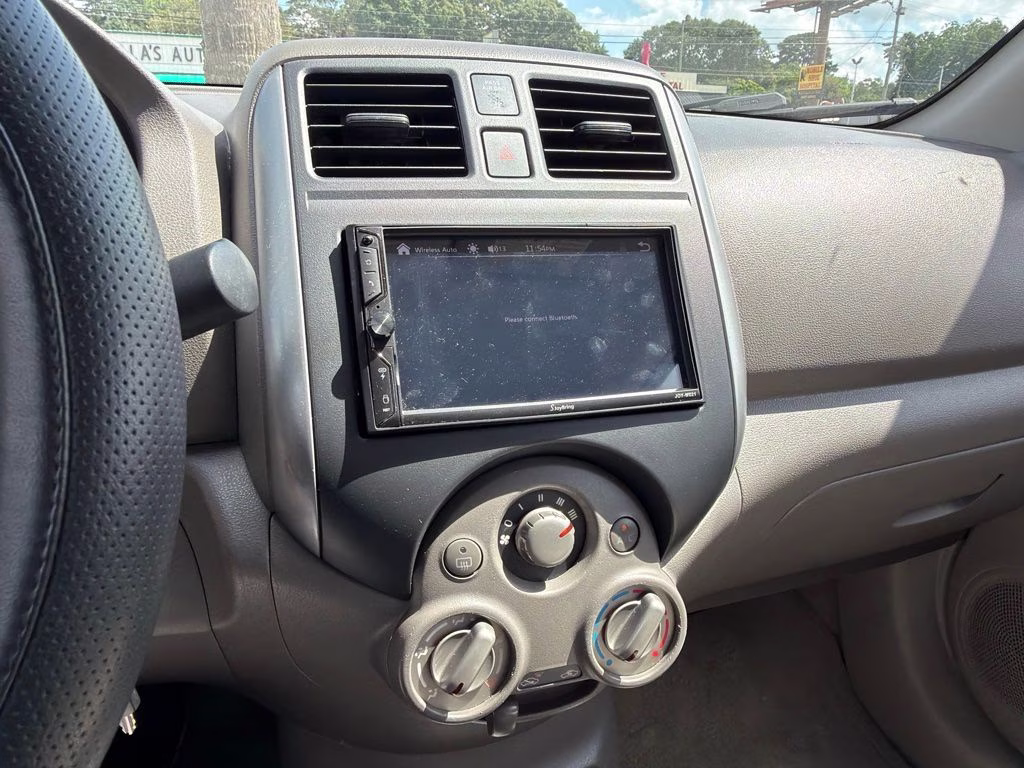 2012 Brilliant Silver Metallic Nissan Versa 1.6 SV FWD Sedan