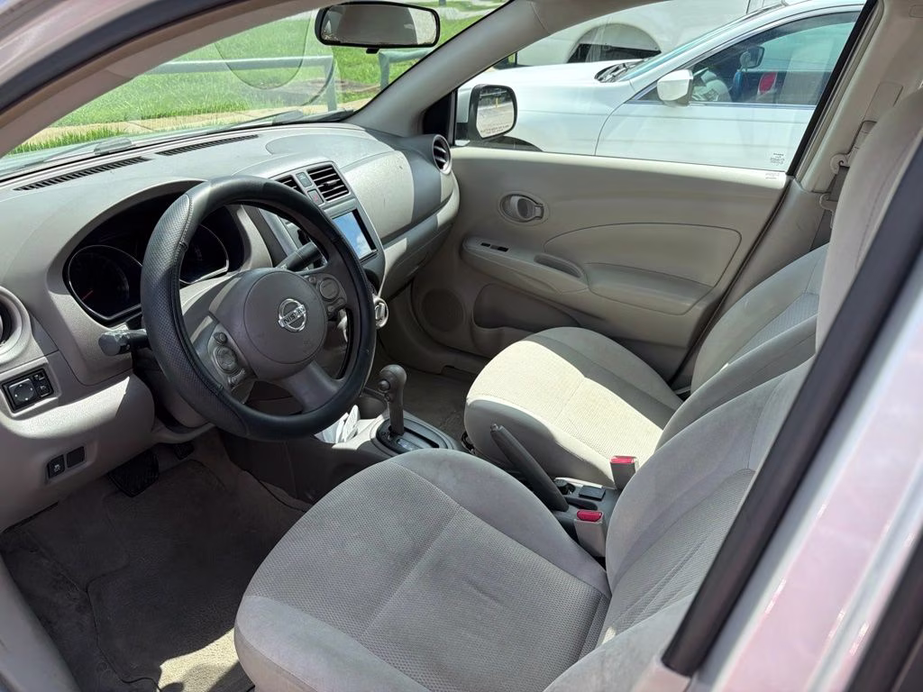 2012 Brilliant Silver Metallic Nissan Versa 1.6 SV FWD Sedan
