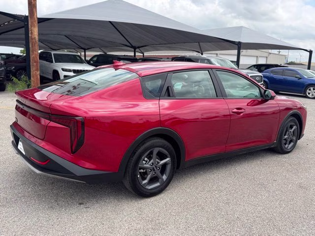 2025 Currant Red Kia K4 LXS FWD Sedan