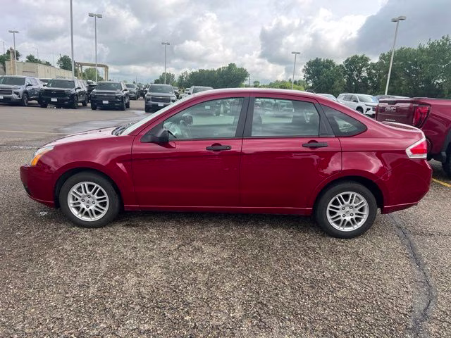 2010 Red Ford Focus SE FWD Sedan
