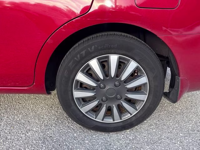 2014 Red Brick Nissan Versa SV FWD Sedan
