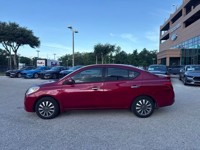 2014 Red Brick Nissan Versa SV FWD Sedan
