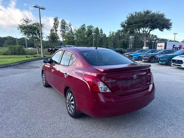 2014 Red Brick Nissan Versa SV FWD Sedan