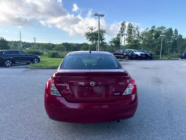 2014 Red Brick Nissan Versa SV FWD Sedan