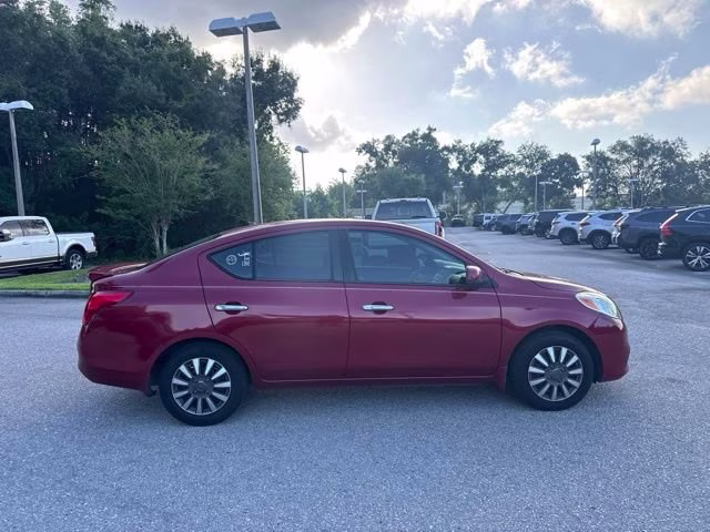 2014 Red Brick Nissan Versa SV FWD Sedan