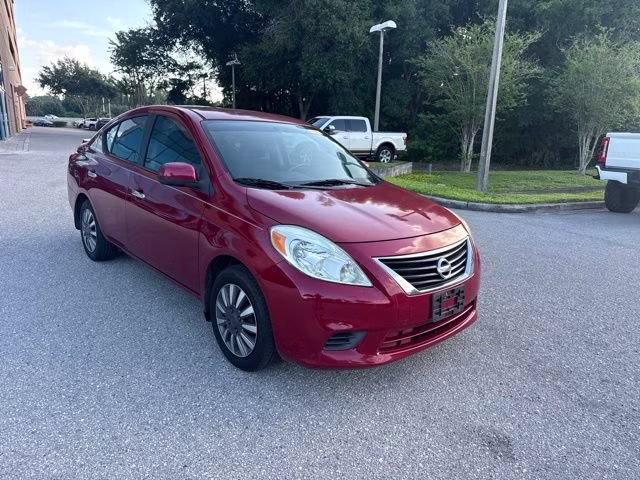 2014 Red Brick Nissan Versa SV FWD Sedan