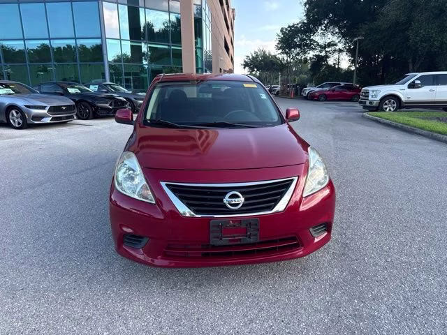 2014 Red Brick Nissan Versa SV FWD Sedan